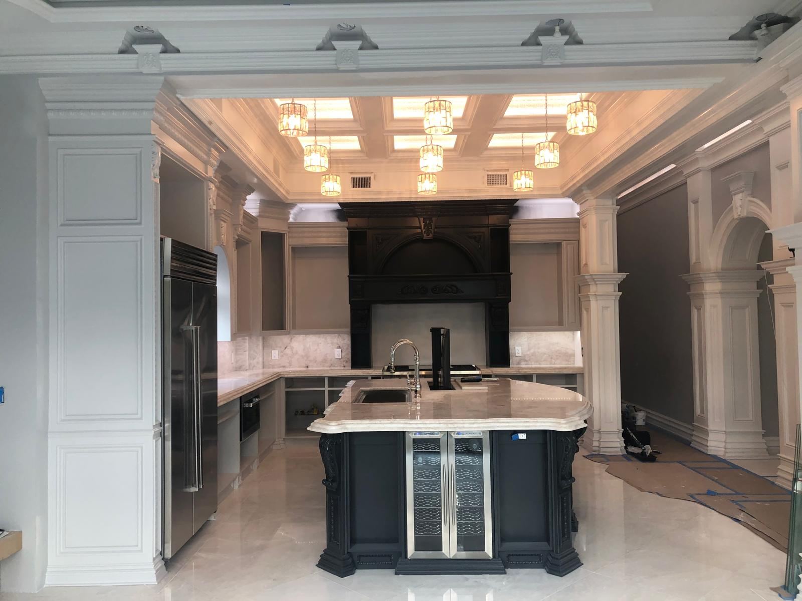 Finished luxury kitchen with black hood and island