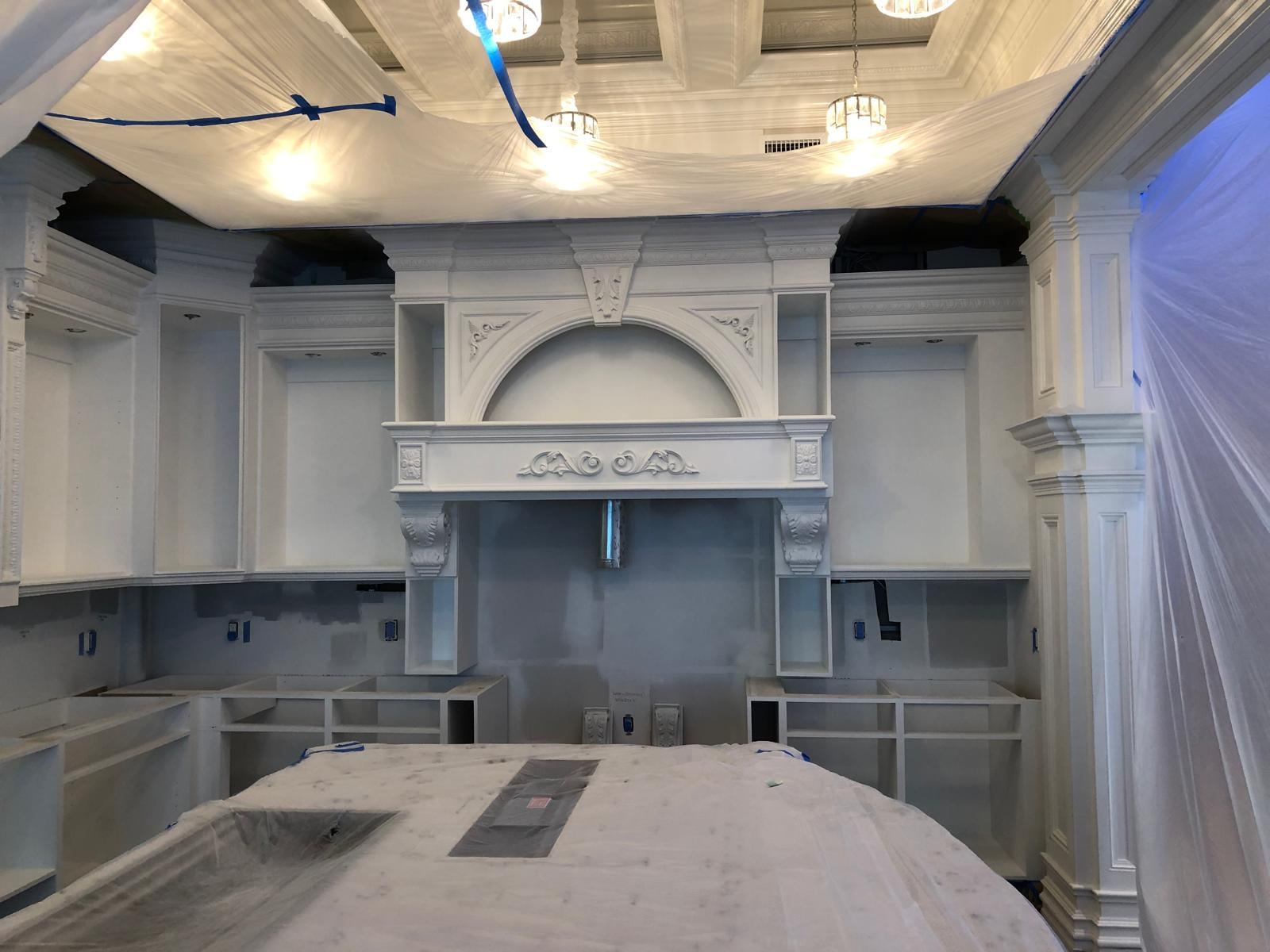Custom kitchen primed during painting