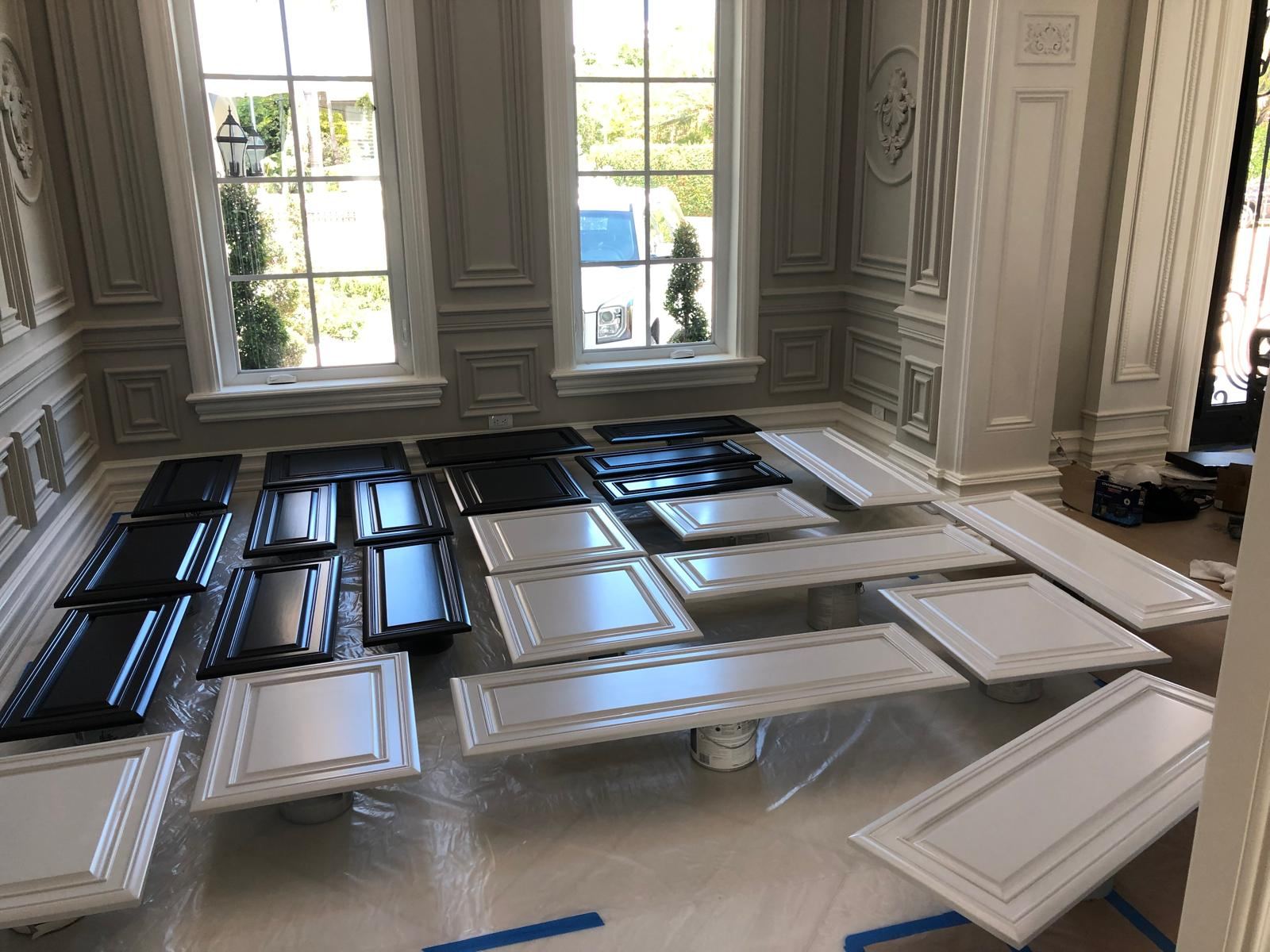 Cabinet doors sprayed black and white