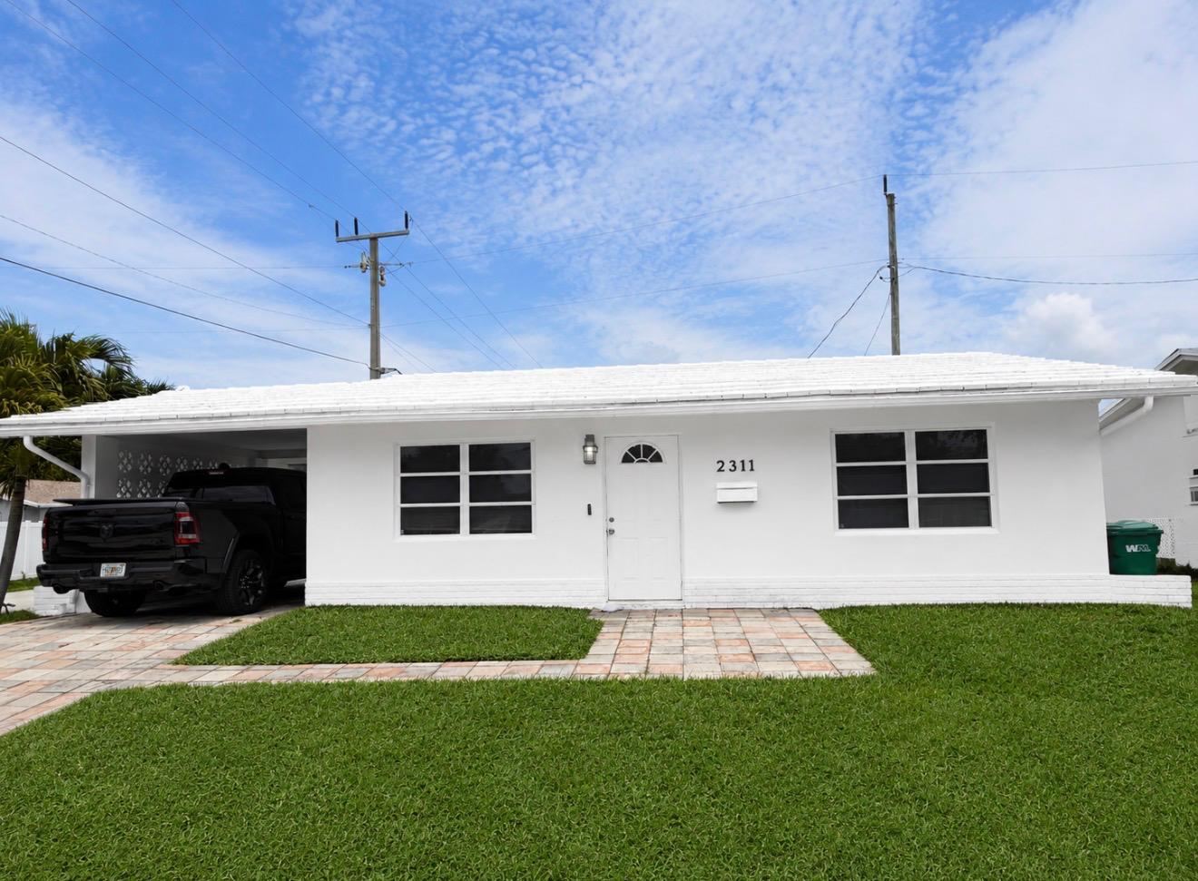 Single-story home painted white